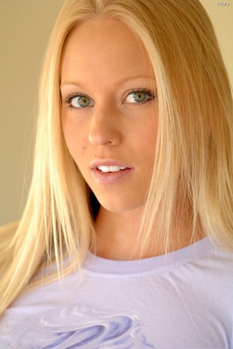 Skinny blonde Mary flashes her tiny boobs and tight ass in a solo striptease