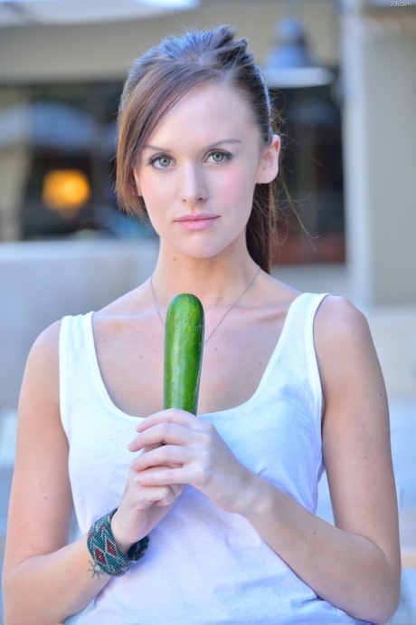 Model Jayden displays her lovely tits & masturbates with a cucumber in a pool