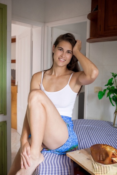 Slender babe Nina Sphinx strips to show her amazing tits & her big ass