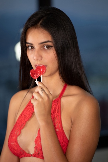 Brunette teen Sarah Joy removes her lacy underwear and fingers her hole