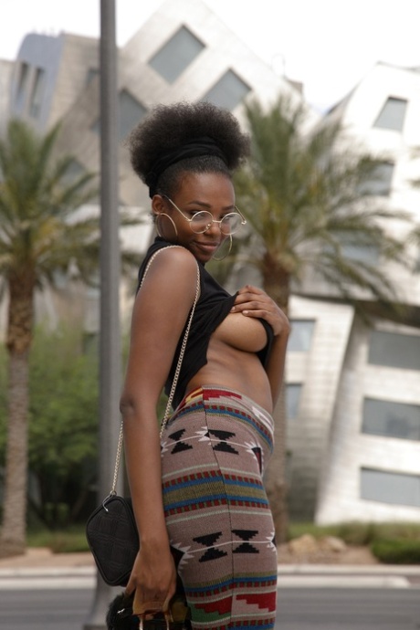 Naughty ebony babe Neda Marie exposes her natural tits & her hot ass in public