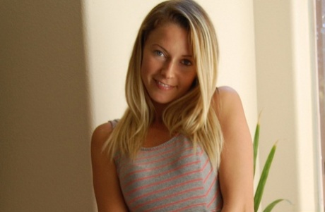 Beautiful babe takes off her cute dress to show her small tits & her hot ass
