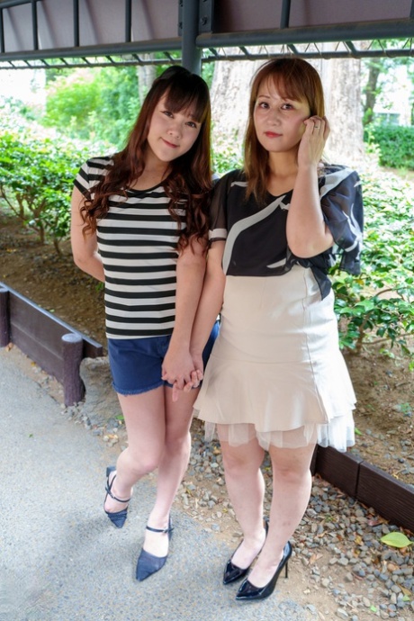Old & young lesbians Aki Sakura & Kyoko Tachibana strip naked & have oral sex
