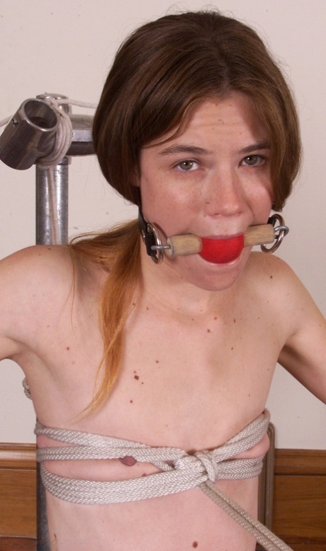 Skinny teen Ashley gets a thorough whipping in rope bondage while naked