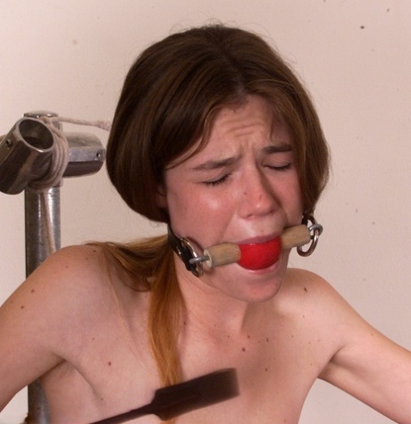 Skinny teen Ashley gets a thorough whipping in rope bondage while naked