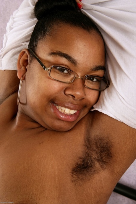 Cute nerdy ebony Monica Jimenez exposes her chubby body and hairy pussy
