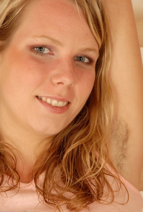 Blonde teen with blue eyes Susie exposes her big tits and tasty pussy