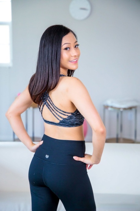 Petite teen Jasmine Grey exposes her yummy ass and small tits in a solo