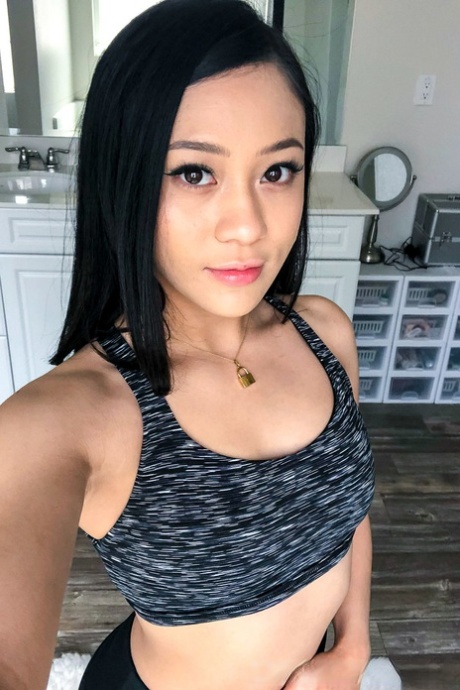 Petite teen Jasmine Grey exposes her yummy ass and small tits in a solo