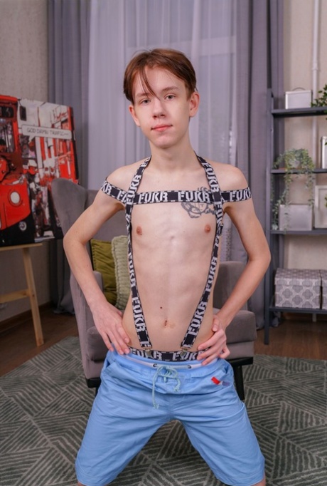 Skinny twink Oscar Miles shows his big dick and his shaved balls up close