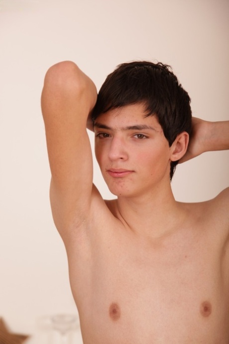 Skinny twink Jake Vosnik strips naked while playing with his hard dick