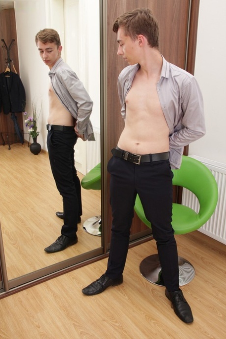 Gay nerd Jack Flynn stripping and stroking his big dick in the mirror