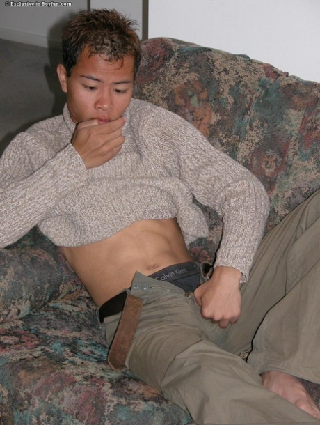 Asian gay hottie Sam strips naked before massaging his uncut dick & big ass