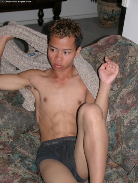 Asian gay hottie Sam strips naked before massaging his uncut dick & big ass