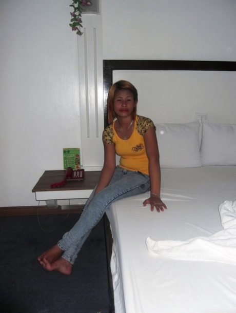 Amateur Asian babe Wella Saad unveils her lovely breasts and poses nude