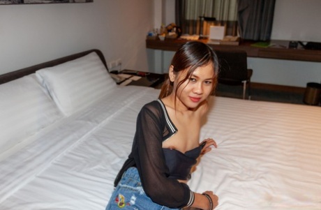 Thai schoolgirl Blue shows her curves before posing with jizz on her face