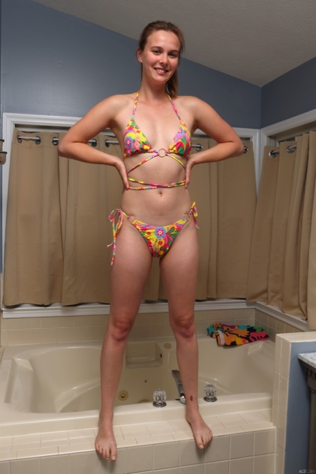 Sexy babe Stella Sedona masturbates with a dildo in the bathroom