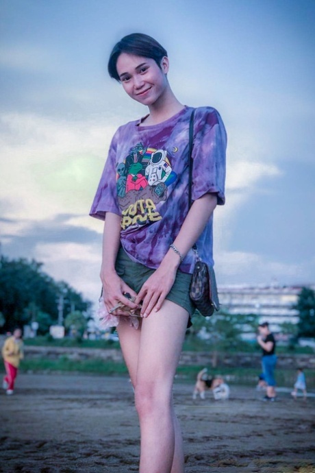 Gorgeous Asian shemale posing fully clothed in public in her own compilation