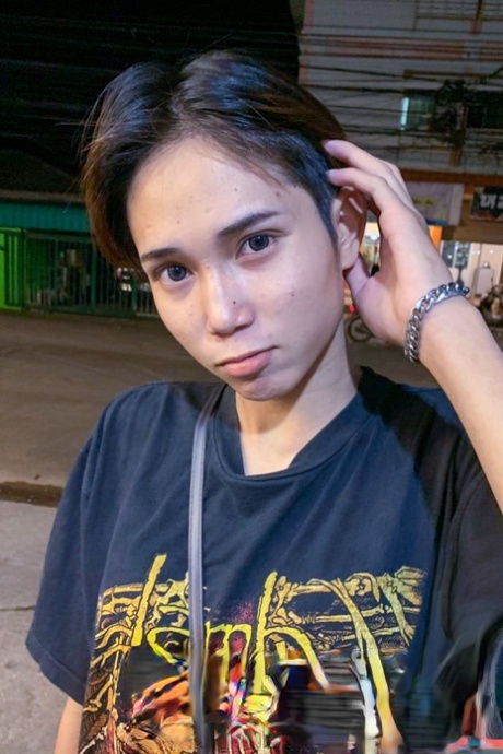 Gorgeous Asian shemale posing fully clothed in public in her own compilation