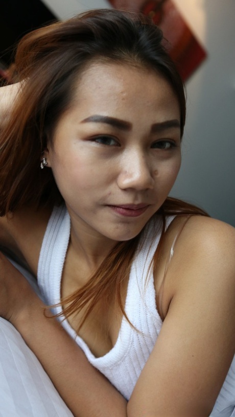 Redheaded Asian teen Meen B strips naked, gives a handjob and fucks in POV