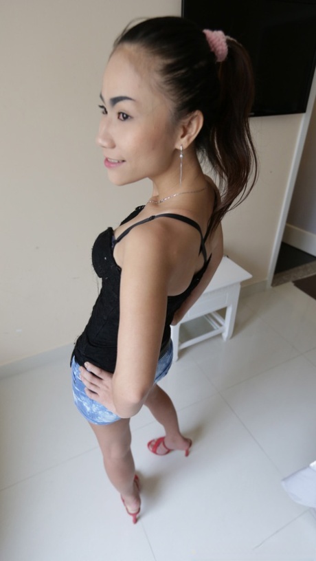 Beautiful Asian girl Ham shows her hairy pussy up close before having sex
