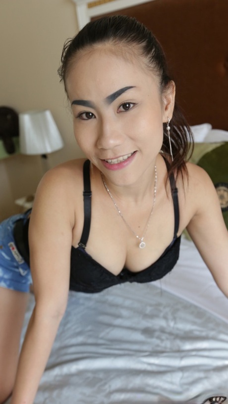 Beautiful Asian girl Ham shows her hairy pussy up close before having sex