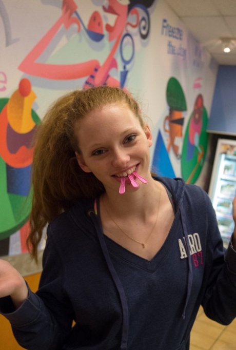 Teen with red hair Wendy Patton gives a sneak peek if her nipple at the gym