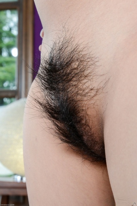 Beautiful Asian babe Omorose spreads her irresistible hairy pussy up close