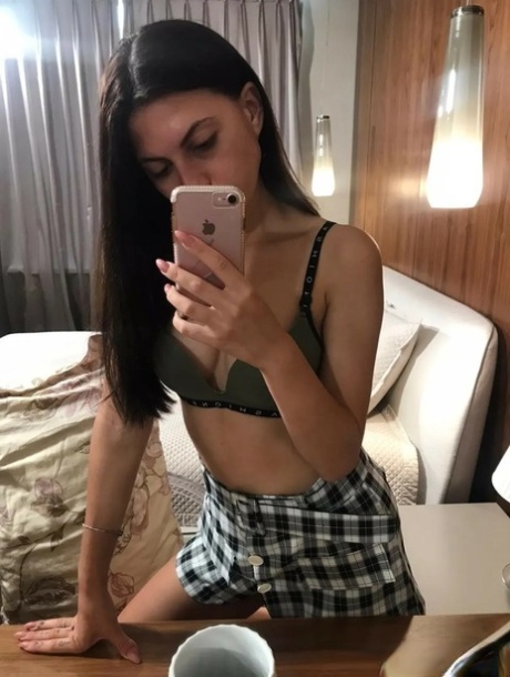 Cute teen shows her suckable titties and shaved pussy in the mirror