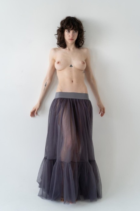 Gorgeous curly haired petite babe shows her beautiful tits while topless