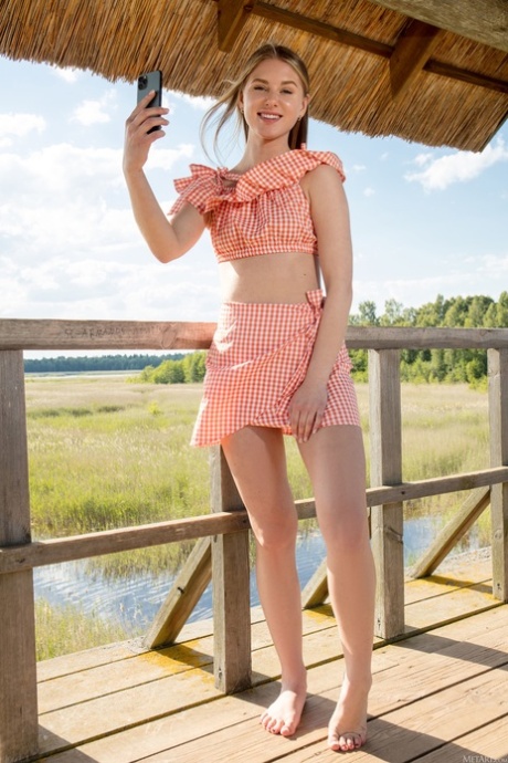 Adorable skinny teen Karianne unveils her amazing big ass and shaved cunt