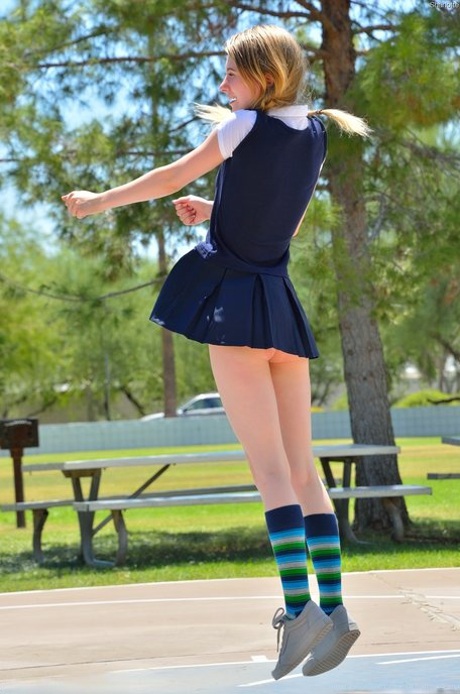 Skinny pantyless teen Sharlotte flashing her clit in public and stripping