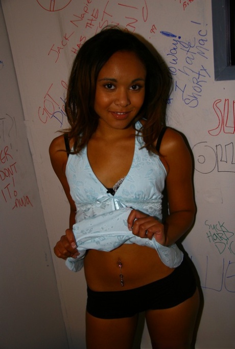 Ebony babe with tiny tits Octavia strips and blows a gloryhole cock