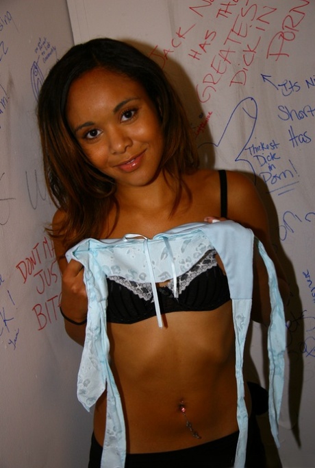 Ebony babe with tiny tits Octavia strips and blows a gloryhole cock