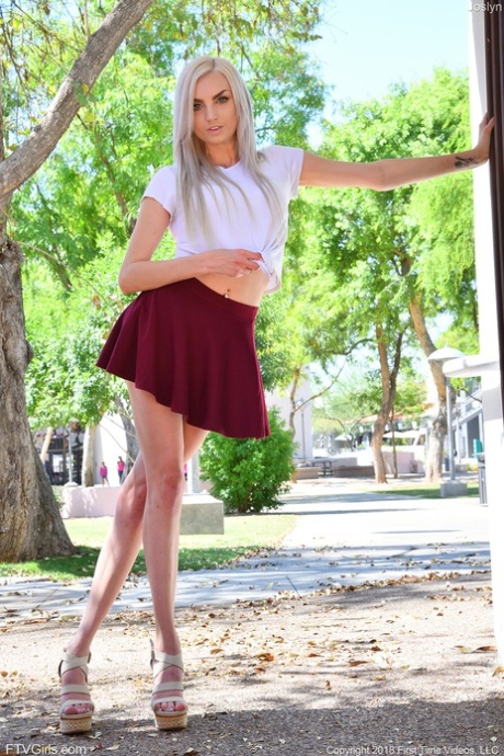 Platinum blonde Joslyn strips to her lingerie & flashes her pussy in public