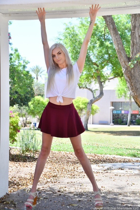 Platinum blonde Joslyn strips to her lingerie & flashes her pussy in public