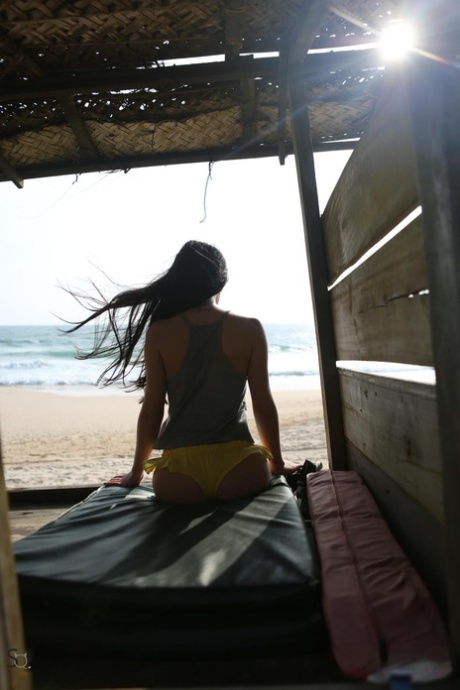 Toned beach babe  Mayer and her sexy friend flaunt their hot asses in the sand